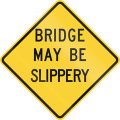 US road warning sign: Bridge may be slippery