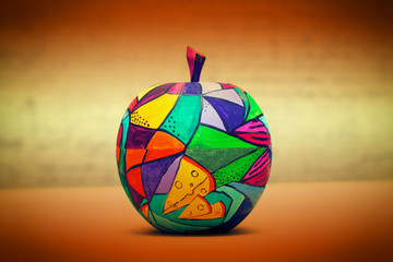 Decorative apple, made of wood and painted by hand paints
