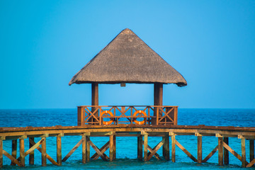 Over water bungalows with steps into amazing green lagoon