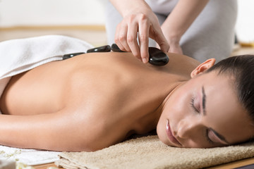 Fototapeta Woman Receiving Hot Stone Massage obraz