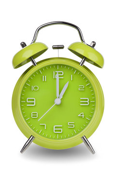 Green alarm clock with hands at 1 am or pm