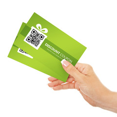 hand holding spring discount coupons isolated over white