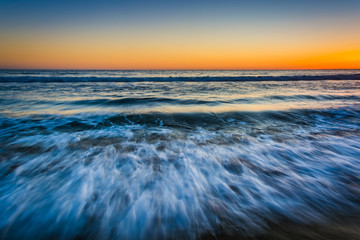 Sunset over waves in the Pacific Ocean, in Santa Monica, Califor