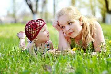 mother and daughter on nature