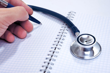 Notebook with stethoscope