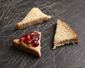 Bread with peanut butter and raspberry jelly
