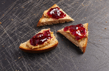 Bread with peanut butter and raspberry jelly