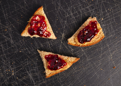 Bread with peanut butter and raspberry jelly