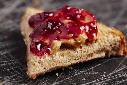 Bread with peanut butter and raspberry jelly