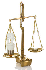 Lightbulb And Coins On Scale