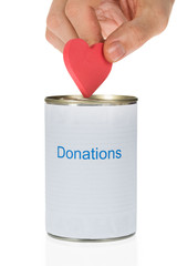 Person Inserting Heart In Donation Can