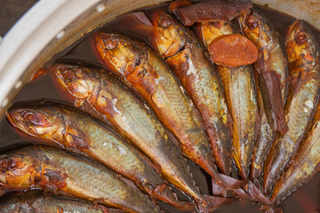 Mackerels boiled with sweet and salt sauce for sell.