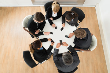 Businesspeople Using Cell Phone
