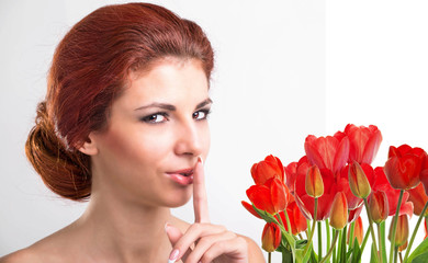 Beauty Woman with Beautiful bouquet fresh red tulips
