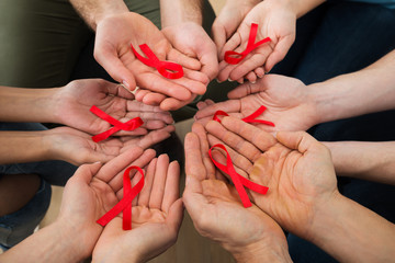 People Holding Aids Ribbon - obrazy, fototapety, plakaty