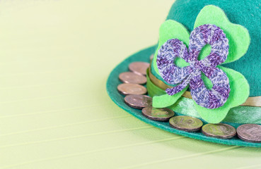 green hat with golden coins - a symbol of St. Patrick's Day
