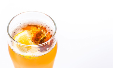 Glass of beer with lemon isolated on a white background