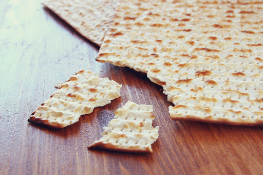 Passover background.matzoh (jewish passover bread) over wooden b