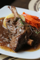 Braised lamb shank in mint and rosemary gravy