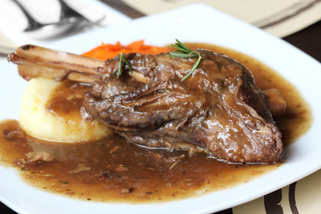 Braised lamb shank in mint and rosemary gravy