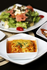 italian lasagna on a square plate