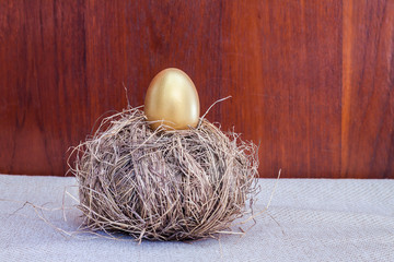 Golden easter egg on hay