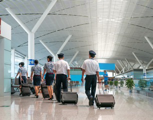 A Flight Crew Walking in the Airport