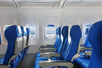 Empty aircraft seats and windows. - 79427647
