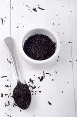 black tea in a bowl and on a spoon