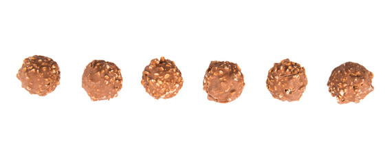 Chocolate balls with nuts over white background