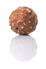 Chocolate balls with nuts over white background