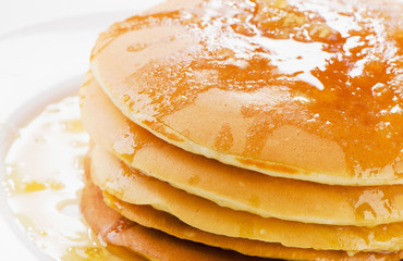 pancakes topped with a honey .