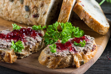chicken liver or goose pate on wholegrain bread and cranberry