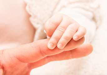 Fototapeta na wymiar Hand of the newborn child