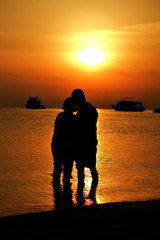 couple at sea at sunset