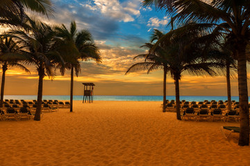 Naklejka na ściany i meble sunrise on the beach of a Caribbean resort