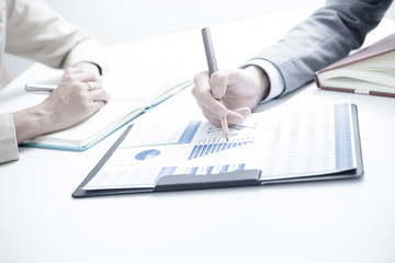 Business people discussing the charts and graphs showing the res