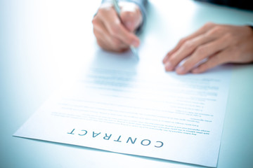 Business man signing a contract