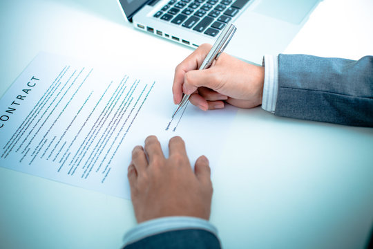 Business man signing a contract