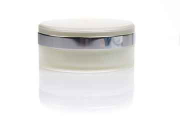 close up of beauty cream container on white background