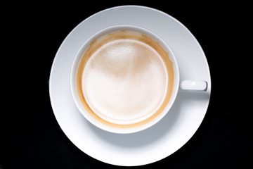 cup of coffee over black background