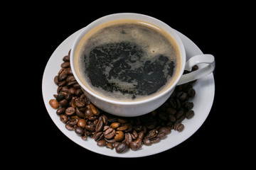 cup of coffee over black background