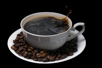 cup of coffee over black background