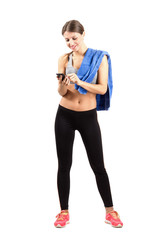 Sporty fitness woman using mobile phone