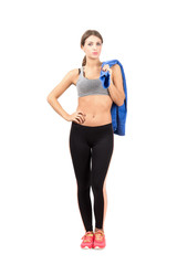 Sporty woman with towel over her shoulder