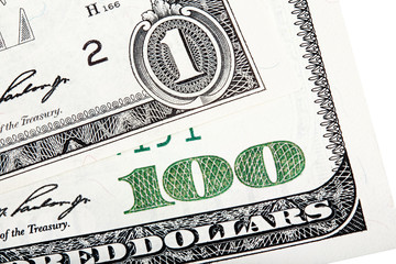 Close-up end stacked photo of one dollar and hundred-dollar bill