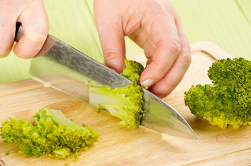 cutting boiled broccoli