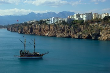 View of Antalya's coastline with tourist ship