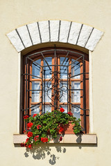Ornate wooden window with flowers