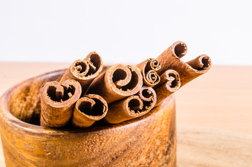 cinnamon on wooden bowl
